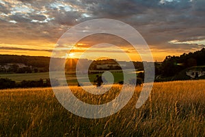 An amazing sunset over the Jeker valley in Maastricht with a dramatic sky