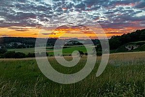 An amazing sunset over the Jeker valley in Maastricht with a dramatic sky