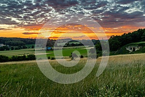 An amazing sunset over the Jeker valley in Maastricht with a dramatic sky