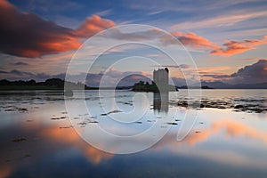 Amazing sunset with reflections at Castle Stalker