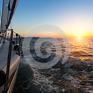 Amazing sunset on a sailing yacht in the Aegean Sea. Travel.