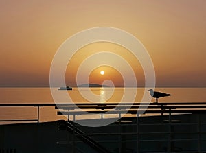 Amazing sunset at sea between Caribbean islands, view from cruise ship open deck