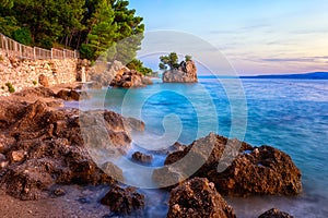 Amazing sunset seascape, scenic view of Brela stone, a symbol of Adriatic resort. Travel background, Croatia