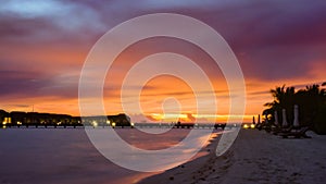 Amazing sunset with seascape and water villas in Maldives.