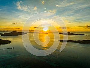 Amazing sunset or sunrise sky over sea landscape,Beautiful colorful light of nature with boats in the sea,Drone camera shot,Top