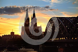 Amazing sunset view on Cologne Cathedral and Hohenzollern Bridge in Koel, Germany