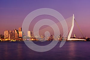 Amazing sunset view of Erasmus bridge and several skyscrapers in Rotterdam, Holland.