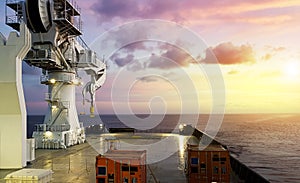 Amazing Sunset view from a modern offshore ship with a large crane on deck