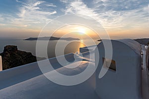 Amazing sunset view from town of Imerovigli to volcano, Santorini island, Thira, Greece