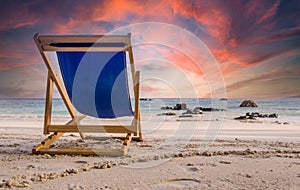 Amazing sunset watched from deck chair at white beach in Ko Lipe, Thailand