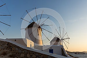 Amazing Sunset and White windmills on the island of Mykonos, Greece