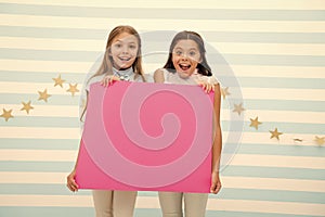 Amazing surprising news. Girl hold announcement banner. Girls kids holding paper banner for announcement. Children happy