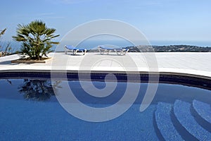 Amazing swimming pool in spanish villa with incredible views to the town and sea below.