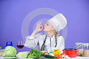 Amazing taste. Turn ingredients into delicious meal. Culinary skills. Woman chef wear hat apron near table ingredients