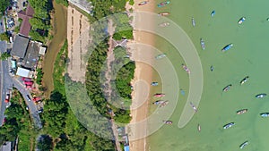 Amazing Top view from Drone camera Longtail fishing boats in the tropical sea at Rawai beach Phuket Thailand