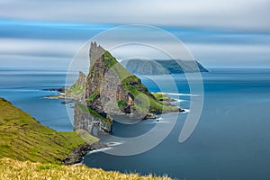 Amazing top view long exposure of Drangarnir gate in front of Tindholmur, Faroe Islands