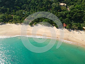 Aerial view of an amazing white sandy beach with turquoise water in tropical country