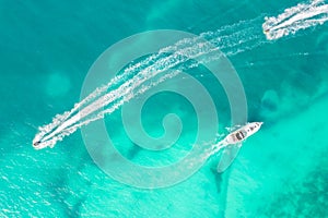 Amazing top view of yacht. Aerial view of luxury floating small ship in blue Caribbean sea. Yacht at the sea in Cancun