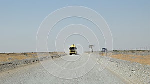 Amazing travel in the desert road in oman. vehicles.