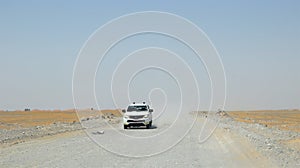 Amazing travel in the desert road in oman. vehicles.