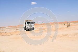 Amazing travel in the desert road in oman. vehicles.
