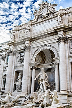 Amazing Trevi Fountain with antique statues against the blue sky. Rome. Italy.