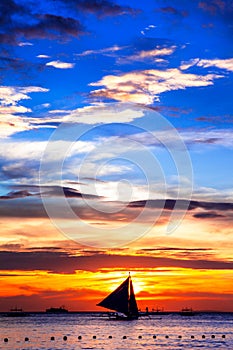 Amazing tropical sunset and silhouette of boat,Boracay.