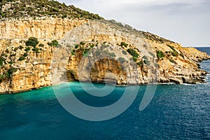 Amazing turquoise beach and cove on the way to Demre - Finike. Detail of cave. Kas, Antalya, Turkey. Summer and holiday background