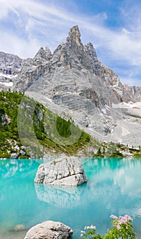 Amazing turquoise Sorapis lake in the mountains in Dolomites, Italy