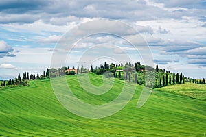 Amazing Tuscany rural landscape in Crete Senesi, landscape with green rolling hills of countryside farm