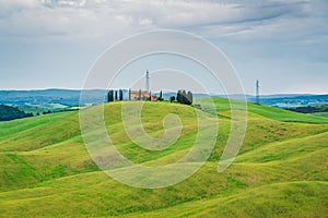 Amazing Tuscany rural landscape in Crete Senesi, landscape with green rolling hills of countryside farm