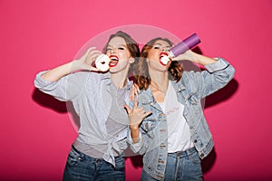 Amazing two women friends eating sweeties