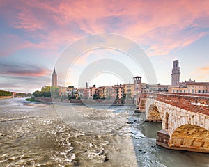 Amazing Verona cityscape view on the riverside with historical buildings and towers