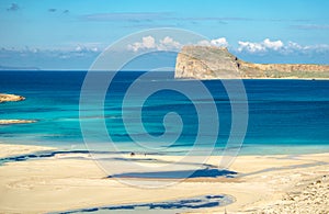 Amazing view of Balos Lagoon with magical turquoise waters, lagoons, tropical beaches of pure white sand and Gramvousa island on C