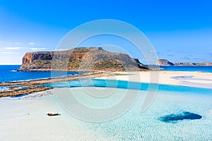 Amazing view of Balos Lagoon with magical turquoise waters, lagoons, tropical beaches of pure white sand and Gramvousa island on C