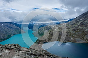 Amazing view of the Besseggen  ridge, famous hiking spot in Jotunheimen National Park, admiring two glacial lakes with different