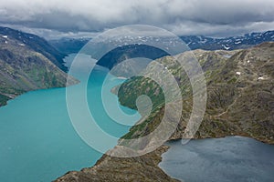 Amazing view of the Besseggen  ridge, famous hiking spot in Jotunheimen National Park, admiring two glacial lakes with different