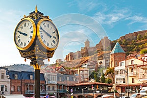 City clock and Narikala fortress, Tbilisi, Georgia photo