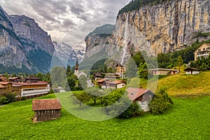 Amazing view of famous Lauterbrunnen town in Swiss Alps valley with beautiful Staubbach waterfalls, Switzerland