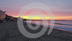 Amazing view of a fiery sunrise with multicolored clouds. Morning time. Ocean view. La Baule-Escoublac, France