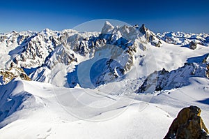 Amazing view of french Alps with the summits covered with snow. Winter holiday in Chamonix-Mont-Blanc during sunny day.