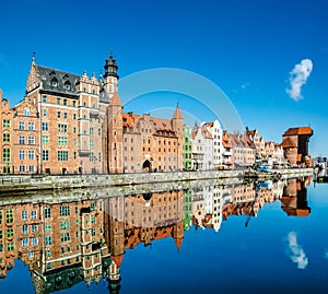 Amazing view of Gdansk old town over Motlawa river with beautiful reflection in the water. Gdansk, Poland, Europe. Artistic