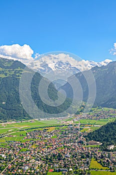 Amazing view of Interlaken and adjacent mountains photographed from the top of Harder Kulm in Switzerland. Swiss Alps landscape.