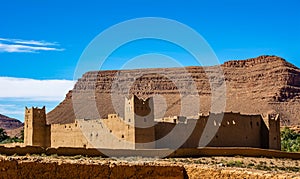 Amazing view of a Kasbah\'s ruin on the way to Kasbah Ait Ben Haddou near Ouarzazate in the Atlas Mountains of Morocco.
