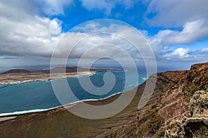 Amazing view on La Graciosa island from Mirador del Rio on a cloudy day, Lanzarote, Spain