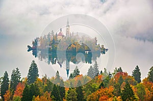 Amazing view of Lake Bled at foggy autumn morning