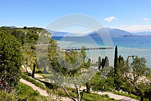 Amazing view of Lake Garda from the hills of the park Parco Pubblico Tomelleri in Sirmione town, Italy