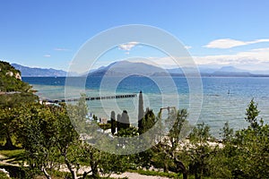Amazing view of Lake Garda from the hills of the park Parco Pubblico Tomelleri in Sirmione town, Italy photo