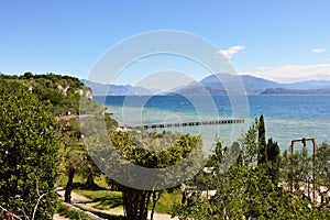 Amazing view of Lake Garda from the hills of the park Parco Pubblico Tomelleri in Sirmione town, Italy