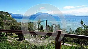 Amazing view of Lake Garda from the park Parco Pubblico Tomelleri in Sirmione town, Italy
